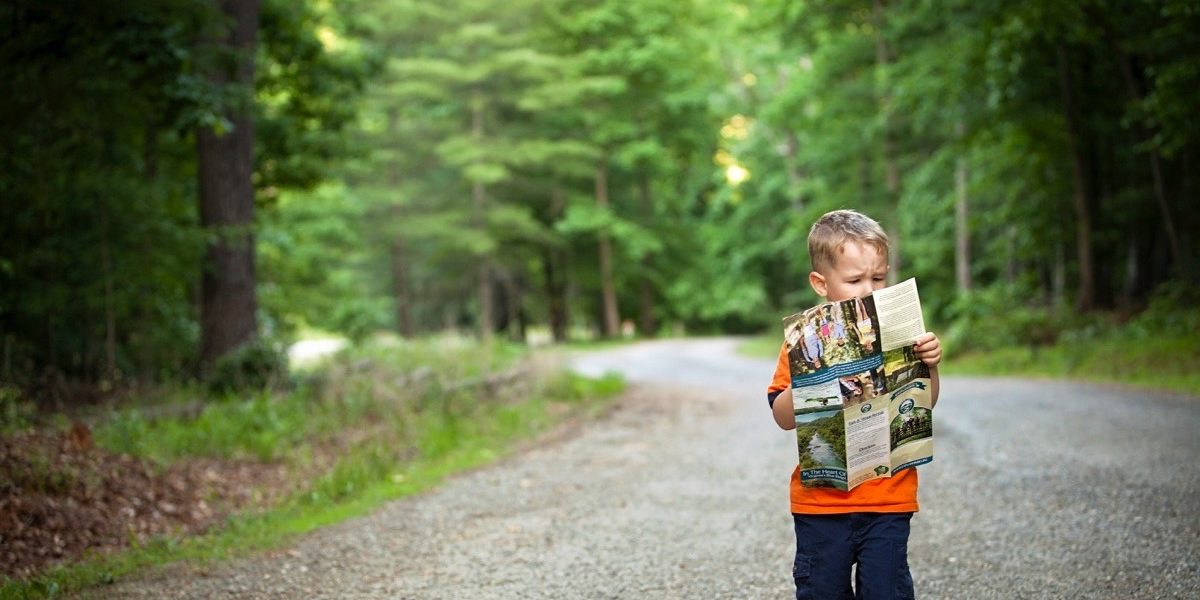 Boy holding a map